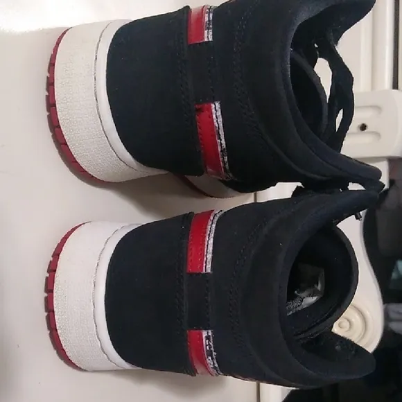 Jordan 1s Newspaper Black and Red High-Top Sneakers
