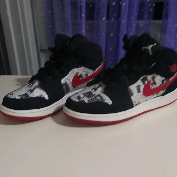 Jordan 1s Newspaper Black and Red High-Top Sneakers